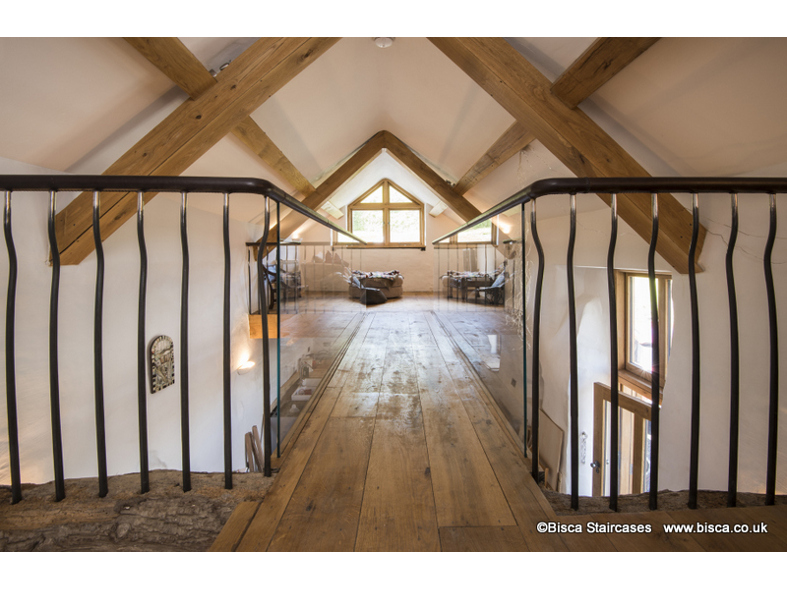 Rustic staircase in a converted listed Shippon