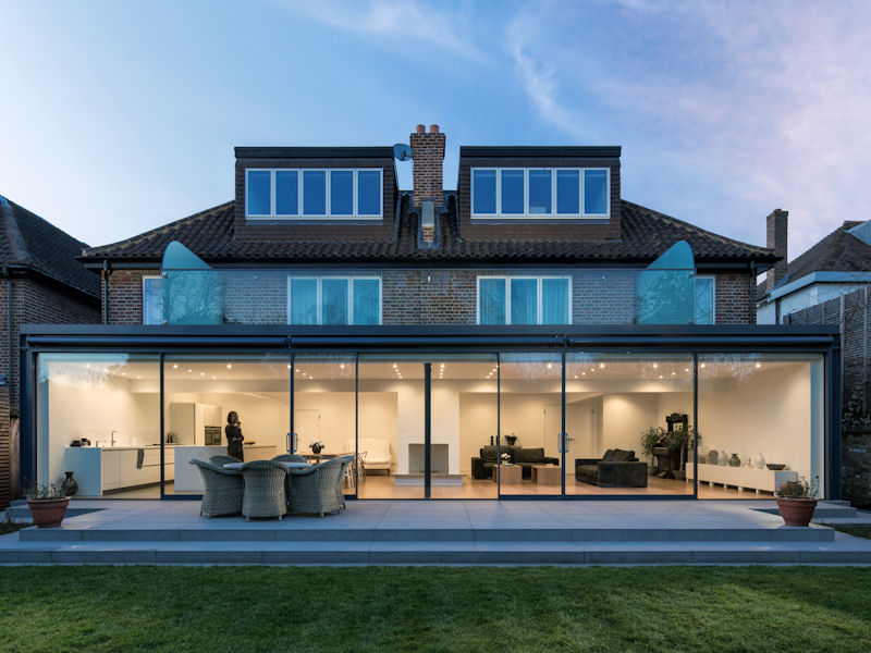 London Practice joins two semi-detached houses with glazed 'picture frame' extension